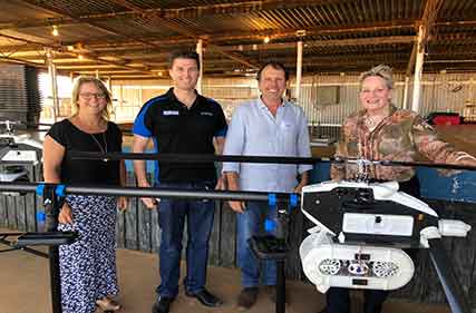 Drone mounted bait delivery system managing wild dogs in remote terrain